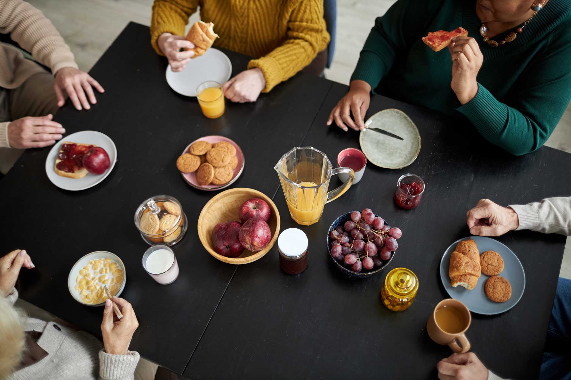 an overhead shot of a group of people having breakfast